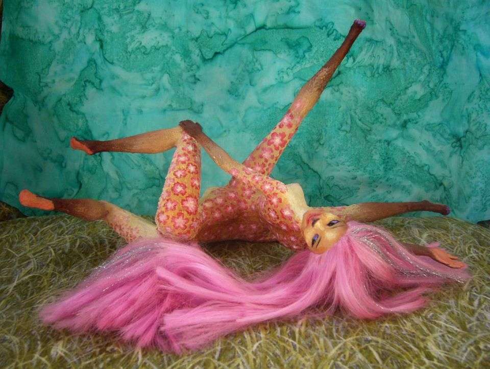 Barbie sculpture illustrating a dream by Chris Wayan: a gracile centauroid dancer, Fuchsia, with pink hair and tail and a floral-dyed pelt, rolling on the floor. Click to enlarge.