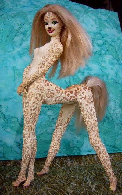Barbie sculpture illustrating a dream by Chris Wayan: a gracile centauroid dancer, Shya, a green-eyed blonde with cloud-leopard spots on cream coat.