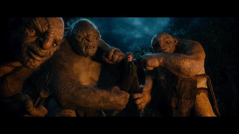 Three trolls capture Bilbo Baggins; still from film 'The Hobbit'.