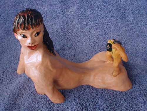 View from above showing the convoluted outline of the model's body where it enters the water, and the astonished look on her face. Click to enlarge.