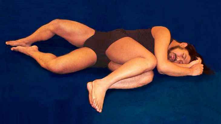 Bearded man in black leotard lying on his side. He has four legs; two stretched out, two curled up. Dream image by Centaurquad. Click to enlarge.