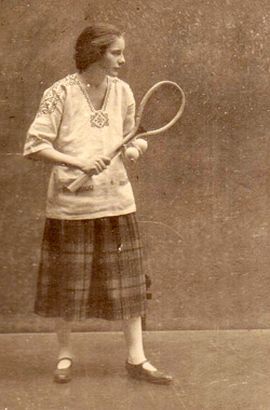 Joan Grant with tennis racket, 1920s?