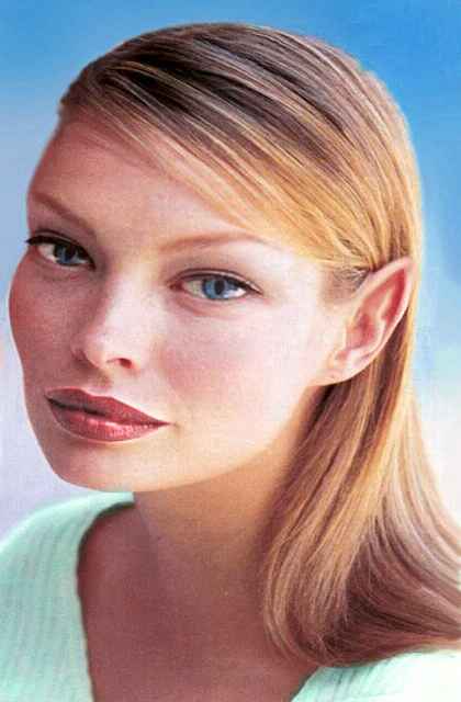 A half-elf: blonde, pointed ears, cat eyes. Based on an old Vogue fashion photo. My apologies to its (anonymous) model.