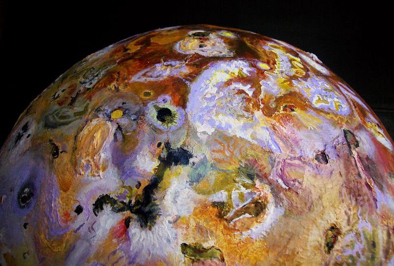 Amirani Fluctus (black reverse L shape) and the lurid-stained plains around Tvashtar on Io, sculpted by Chris Wayan. Click to enlarge.