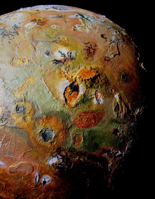 Green and brown terrain around Euboeia Mons, southern Io. Click to enlarge.