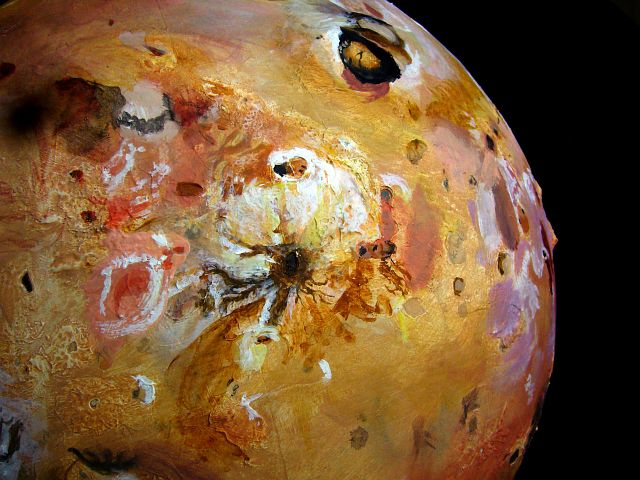 Sculpted portrait of Io by Chris Wayan. Equator from low orbit; Horus and Ra, foreground; Loki, black patch upper right; Boosaule Mt (18 km high) on horizon.