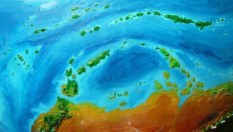 High orbital photo of the green equatorial island chains northwest of Ata, largest continent on Kakalea, a model of an Earthlike world full of Australias.
