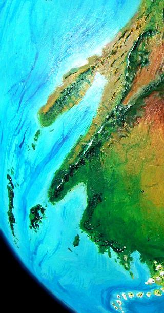 Orbital shot of the green, mountainous east coast of Bima, on Kakalea, a model of an Earthlike world full of Australias.