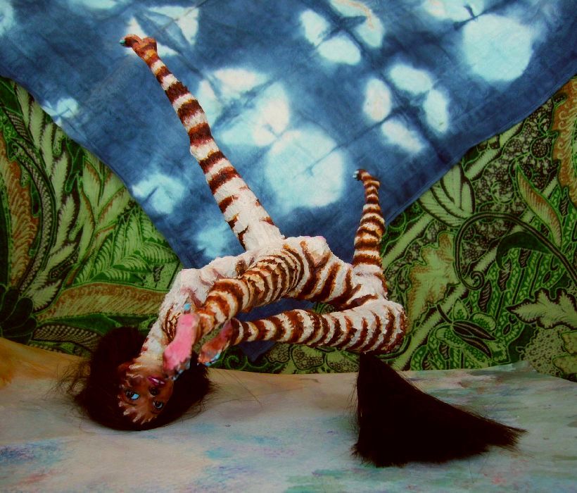 Aifelle, a zeba-striped centauroid dancing a dream, before fabric mountains and stars, on Kakalea, a model of an Earthlike world full of Australias. Click to enlarge.