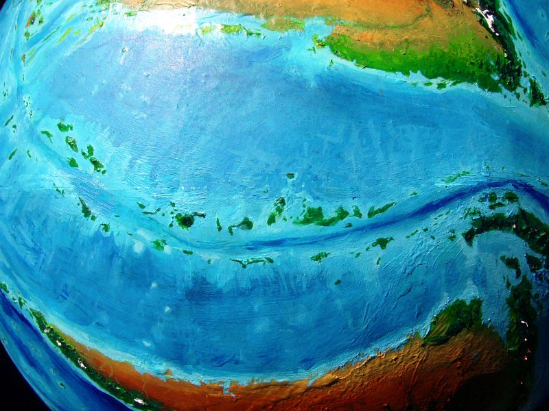 High orbital photo of two parallel chains of rainforested equatorial islands, the Ibats and Twibbas, on Kakalea, a model of an Earthlike world full of Australias.