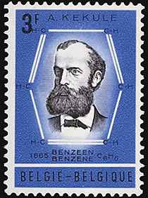 A blue Belgian stamp commemorating Kekul's discovery of benzene's structure. Kekule's bearded face, bordered by a schematic of the benzene ring.