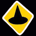 Sign seen in a dream of a parallel Earth, 'The Lead Hazard of Witches' by Chris Wayan: yellow hazard signs showing a witch's hat: marking a disposal site for the supposedly toxic remains of burned witches.