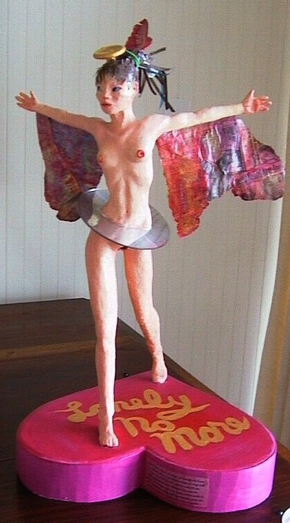 The Dating Fairy, on her heart-shaped box of 'Lonely No More' Valentine candy, her singles-ad wings spread. Her AOL CD-ROM tutu hides her vaginal modem.