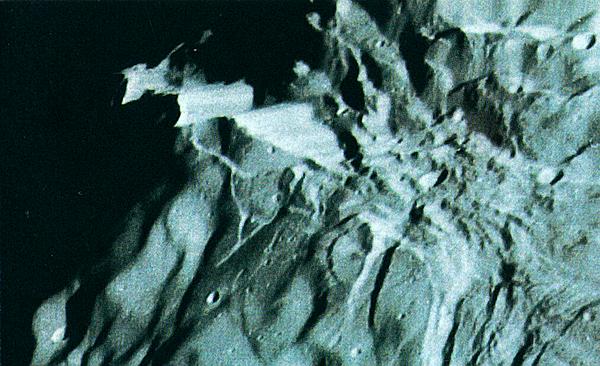 NASA photo of canyon on Saturn's moon Miranda.
