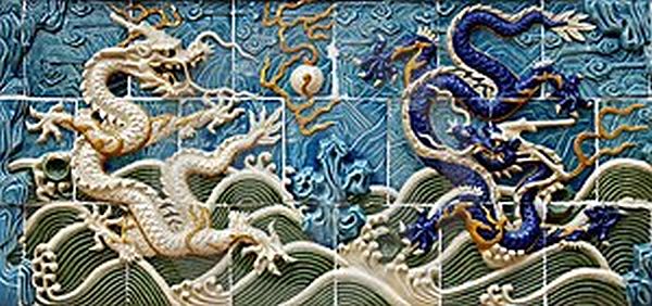 Chinese bas-relief of two dragons on an undulating sea. Image from dreamtime.com, by Bedo.