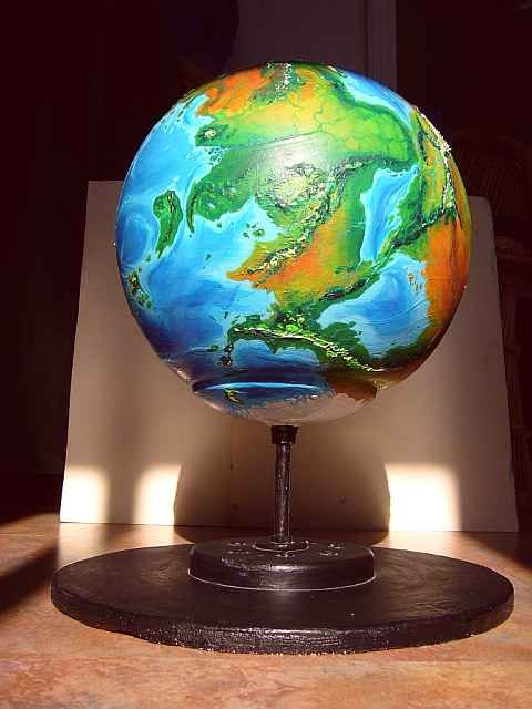 Photo of Serrana's globe, showing its stand and the south polar problem it creates.