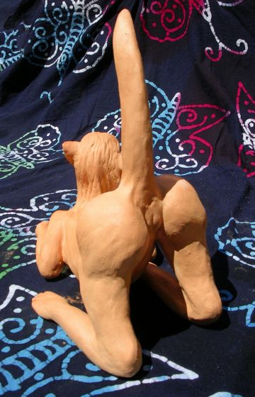 Sphinx seen from back; unfired clay sculpture.  Click to enlarge.