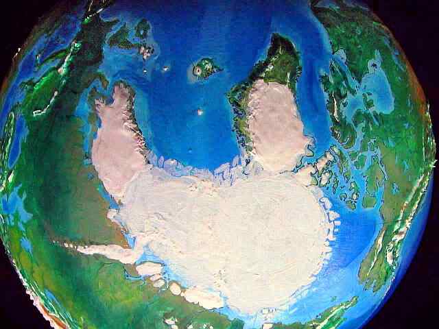 Orbital photo of Turnovia, an upside-down  Earth: the South Pole, showing the twin icecaps of Scandinavia and Greenland.