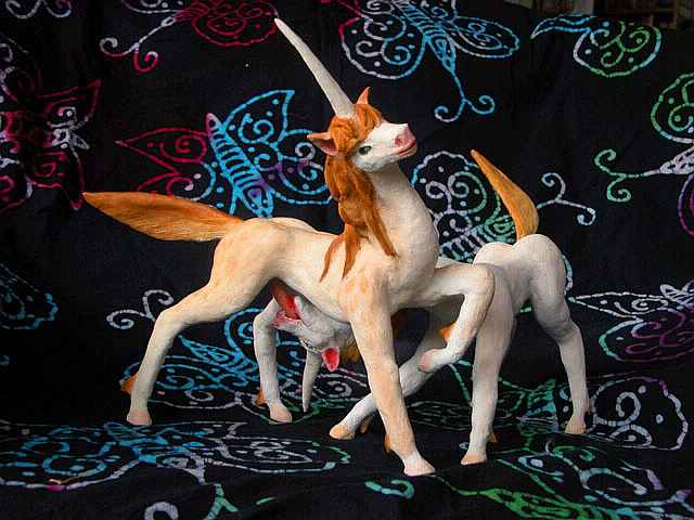 A unicorn mare licking a stallion: sculpture. Click to enlarge.