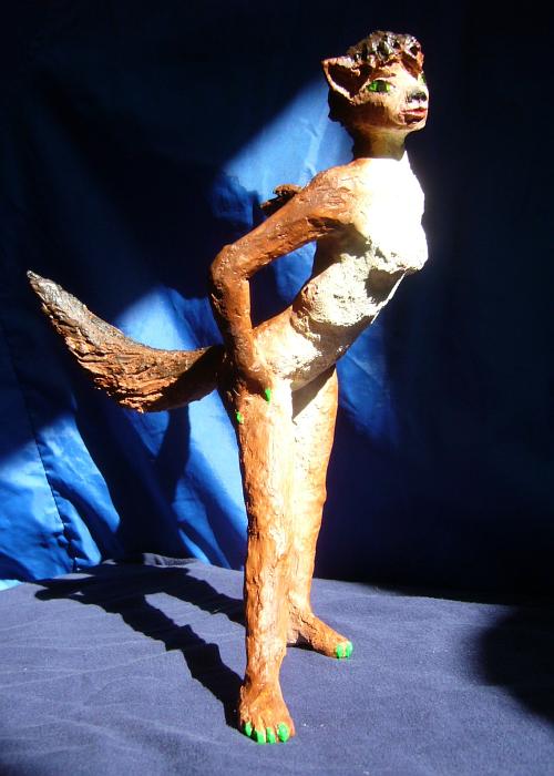 Sculpture of a dream by Chris Wayan: a wolf dancer about 25 cm tall (10 in.). Click to enlarge.